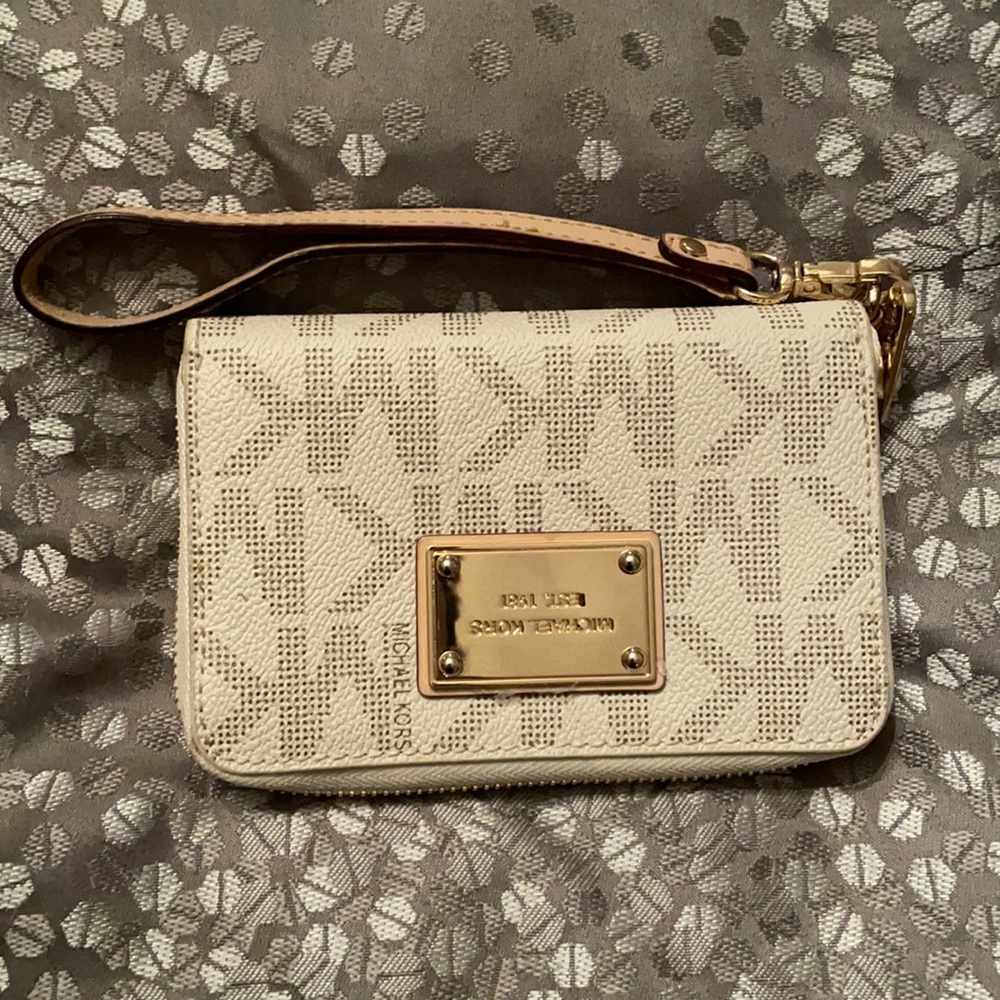 Michael Kors cream and gold wristlet wallet.